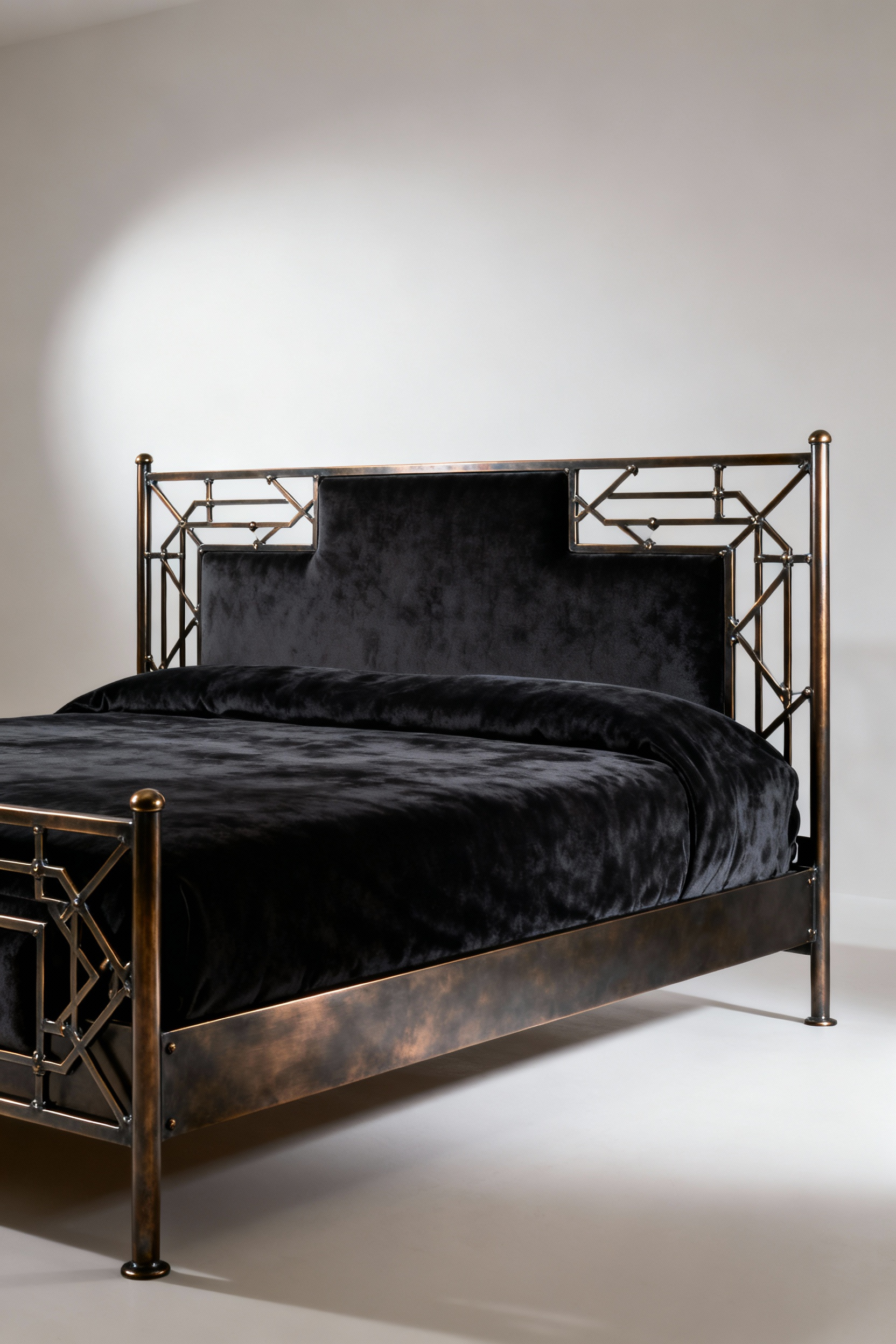 A luxury king-size bed frame with a velvet headboard and dark bronze forged alloy accents, embodying enduring elegance in a refined bedroom setting.